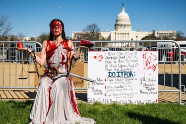 Washington DC, USA demonstrator covered in fake blood on the National Mall