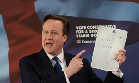 David Cameron holds the note left by Liam Byrne