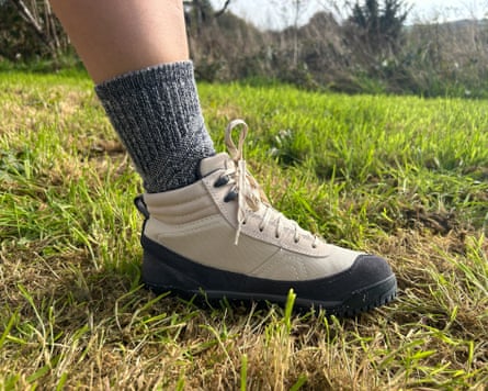 The writers leg wearing grey socks and a beige Xero walking boot