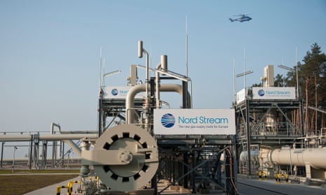 A helicopter flies over the Nordstream gas pipeline terminal.