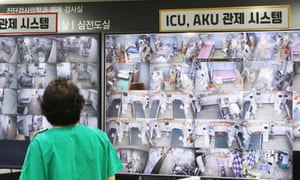 A medical worker looks at a screen showing negative pressure quarantine rooms at Bagae Hospital in Pyeongtaek, 70km south of Seoul, South Korea.