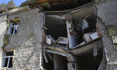 A baby bed is seen inside an apartment building damaged by Russian shelling in Bakhmut, Donetsk.