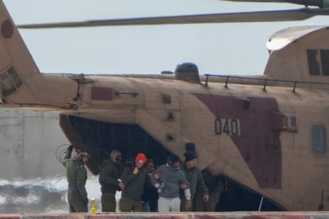 Freed Israeli hostage Avera Mengistu exits a military helicopter as he arrives to the Ichilov hospital after being released by Hamas, in Tel Aviv, Israel.