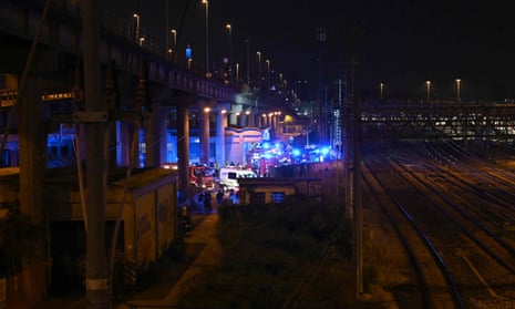 Rescuers work at the site of a coach accident on Wednesday in Mestre, near Venice