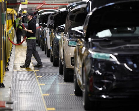 A member of staff works on the production line at Jaguar Land Rover’s factory in Solihull