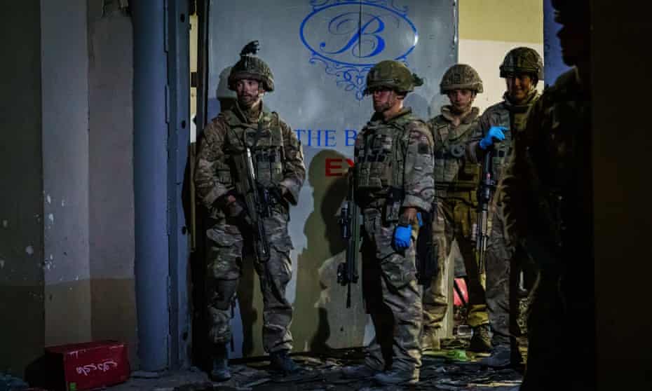 British soldiers secure the outer perimeter of the Baron hotel in Kabul