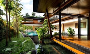 The Singapore bungalow boasts a swimming pool winding its way through the house, as well as a waterfall cascading through the property.