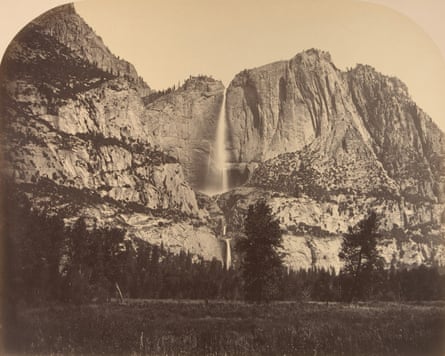 Sepia-toned image, taken from level of Yosemite Valley, of waterfall shooting consecutive complete sheer, precocious cliff.