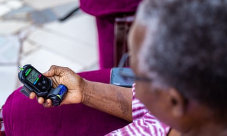 Elisaria Matau monitors her diabetes at home in Dar es Salaam