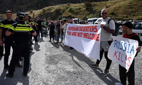 Georgian activists protest against Russians crossing the Kazbegi / Verkhnii Lars border point between the two countries.