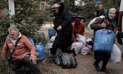 Residents of Vovchansk and nearby villages with their possessions at an evacuation point in the Kharkiv region of Ukraine