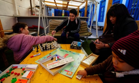 A Venezuelan couple play with their children at a shelter in the Yungay neighbourhood of Santiago, Chile, in May. After fleeing Venezuela and finding life as a migrant intolerable in Colombia and then Ecuador, the family migrated to Chile.