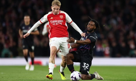 Emile Smith Rowe of Arsenal battles for the ball with Luton's Fred Onyedinma