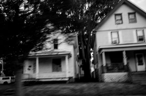 blurry view of two homes and a tree