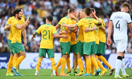 The Socceroos celebrate Mitchell Duke’s opening goal  against New Zealand in Auckland.