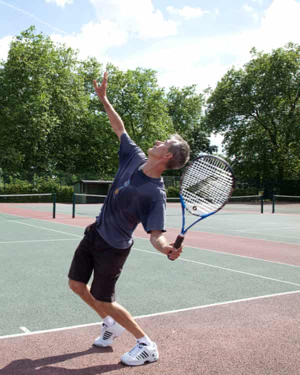 Geoff Dyer serves, Queens Park tennis courts, London