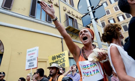People protest in Rome against compulsory vaccinations.
