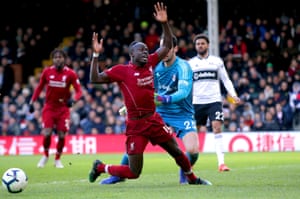 Fulham’s goalkeeper Sergio Rico fouls Liverpool’s Sadio Mané, resulting in a penalty.