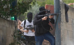 Jenin, West Bank: Palestinian militants take aim at Israeli troops during clashes
