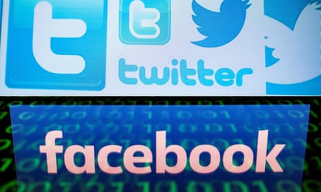 Facebook and Twitter logos on a computer screen