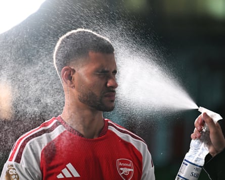 Bruno Guimarães in his new Arsenal shirt at his unveiling
