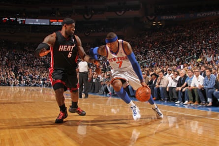 Carmelo Anthony of the New York Knicks dribbles past LeBron James of the Miami Heat during a 6 May 2012 game.