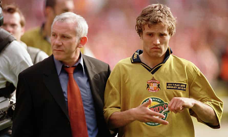 Gray walks off the pitch with manager Peter Reid after missing the last penalty in the shootout.