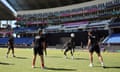 England players warm up during a net session at the Sir Vivian Richards Stadium