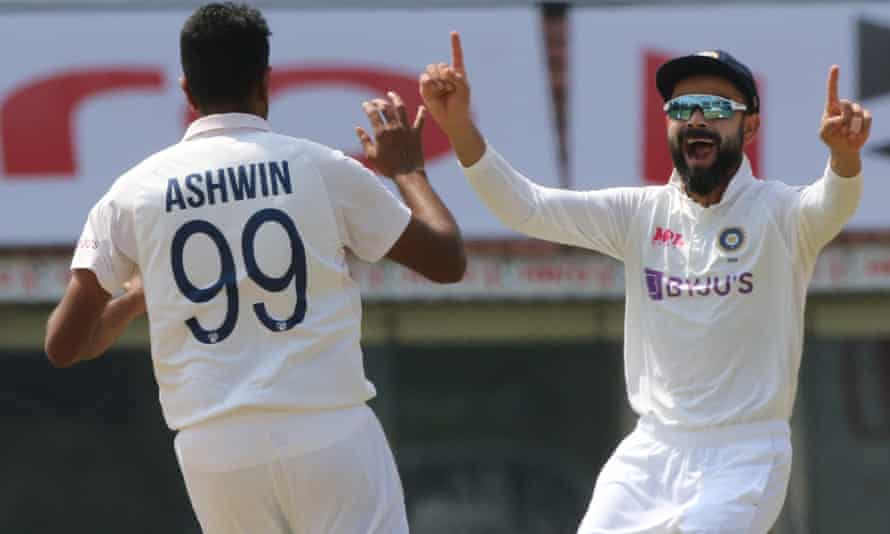 Ravi Ashwin and Virat Kohli celebrate the wicket of Rory Burns that brought Lawrence to the crease