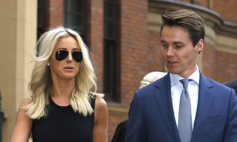 Oliver Curtis, who is on trial for alleged insider trading, leaves court in Sydney on Wednesday with his wife.