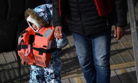 A child who was rescued at sea while crossing the English Channel, in Dover.