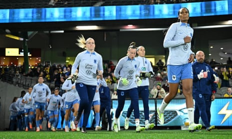 Wendie Renard leads the French team out for their warm up