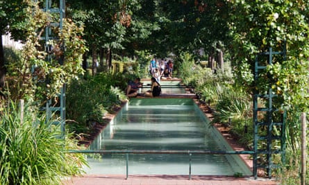 A garden and pool area on viaduct.