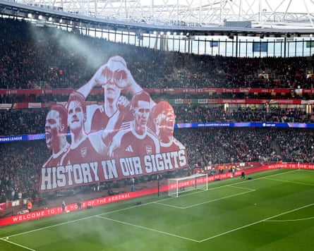 Arsenal fans unveil a tifo before their Champions League second-leg tie against Sporting.