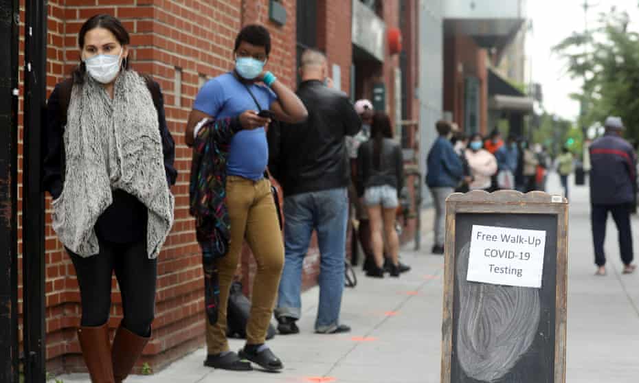 People wait in line for coronavirus testing in Washington. 
