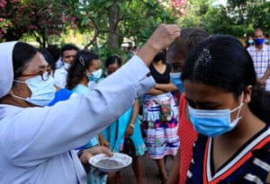 Ashes are sprinkled on the heads of followers at a Catholic church in Dili, East Timor
