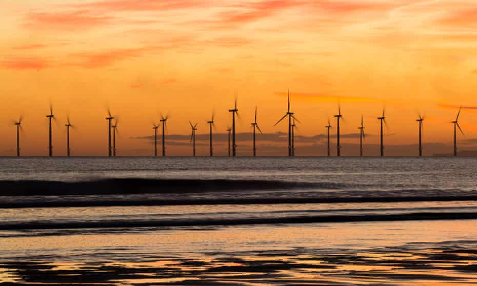 Sunrise from Seaton Carew beach, near Hartlepool, with Teesside offshore windfarm in the distance.