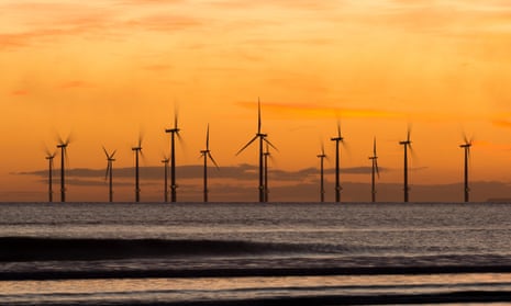 Sunrise from Seaton Carew beach near Hartlepool, northern England, with the Teesside offshore windfarm in the distance. 