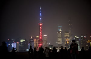 The Oriental Pearl tower in Shanghai is lit in red, white and blue as the Chinese express their solidarity with France.