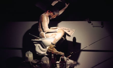 Pope.L in a 2000 performance of Eating the Wall Street Journal.