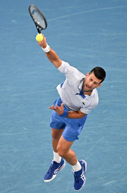 Novak Djokovic serves against Adrian Mannarino during their fourth-round Australian Open match at Rod Laver Arena