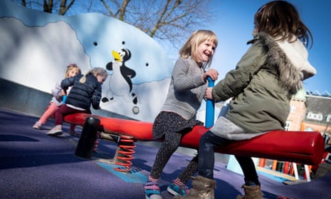 Children from a kindergarten in Copenhagen play in the city’s Tivoli gardens.