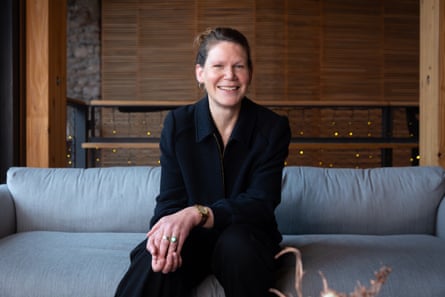 Rebecca Dawson sitting on a grey sofa