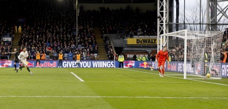 Dean Hendeson turns towards the ball in his net after Enzo Fernández scored a penalty