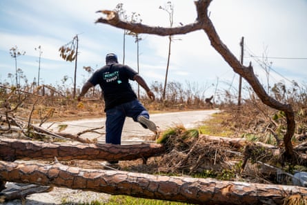 Pastor Pedyson Baillou makes his way to his destroyed home in the High Rock neighborhood in the eastern part of Grand Bahama island on Friday.