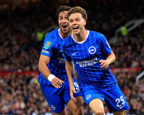 The Brighton players Charalampos Kostoulas and Maxim De Cuyper celebrate the latter scoring his team's third goal in their 3-2 win away to Manchester United in the third round of the Carabao Cup.