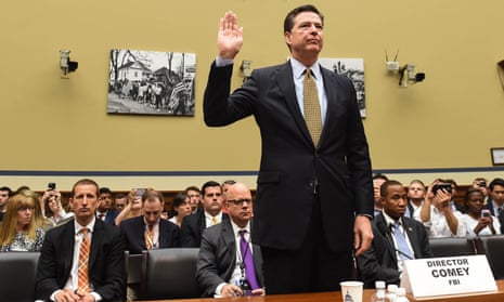 James Comey swears an oath before the House oversight committee before testifying about the investigation into Hillary Clinton’s email system.