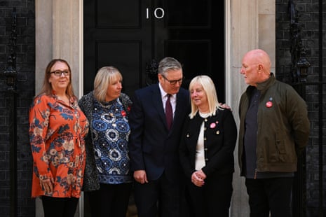 Keir Starmer, centre, with Charlotte Hennessy, left, Sue Roberts, second left, Margaret Aspinall, second right, and Steve Kelly, right, at 10 Downing Street. They are some of the relatives who have been campaigning for the Hillsborough law – the public office (accountablity) bill – being published today.