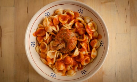 Orecchietta and braciola meat roll with tomato sauce.