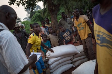 Displaced people from Gambo count bags of grain in Loungougba, in south-east Central African Republic